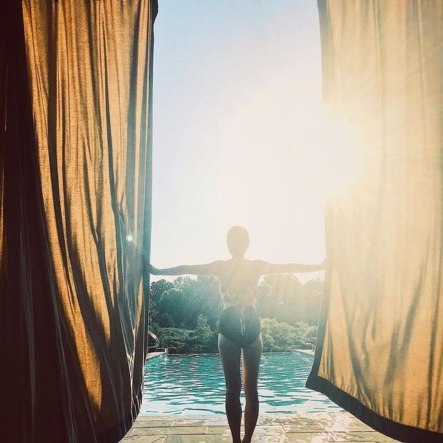 A woman looking out over the pool