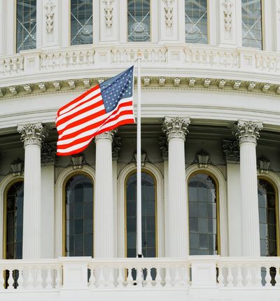 Capital Building with the American flag.