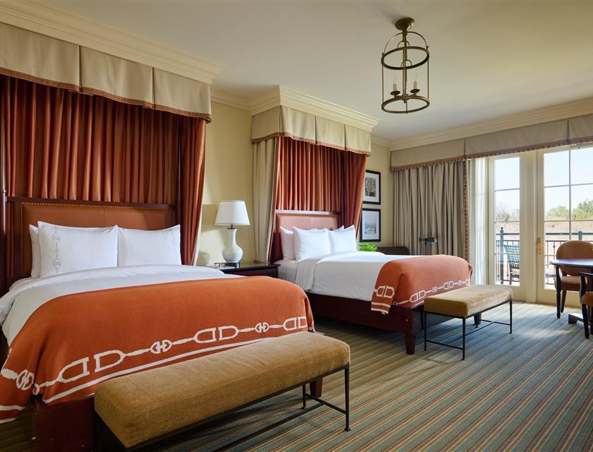 Picture of two queen beds and outdoor terrace